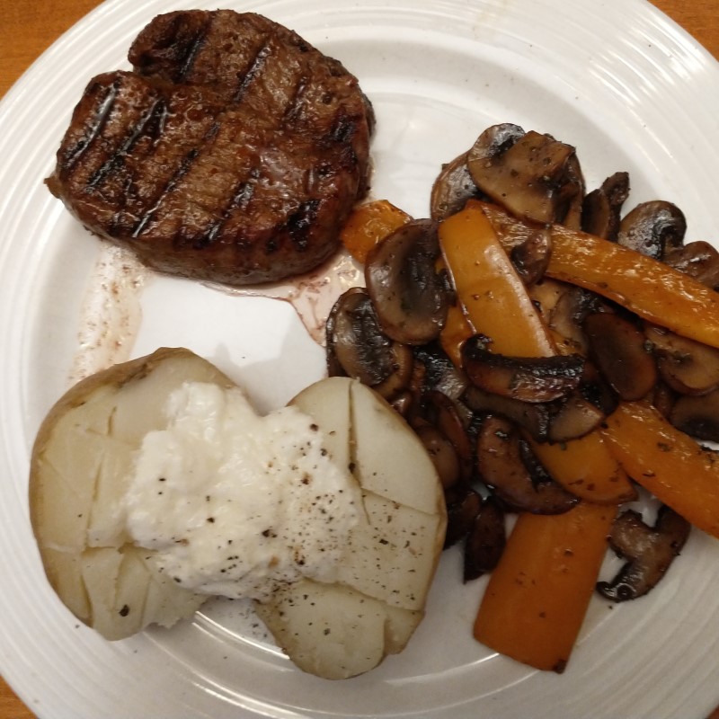 filet with mushroom-pepper sautee and baked potato